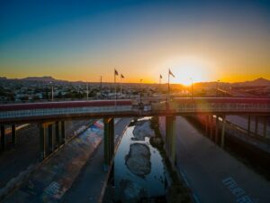 sun setting over bridge in Texas